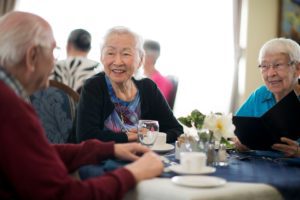 Elderly women socializing at an assisted retirement community at Silver Birch