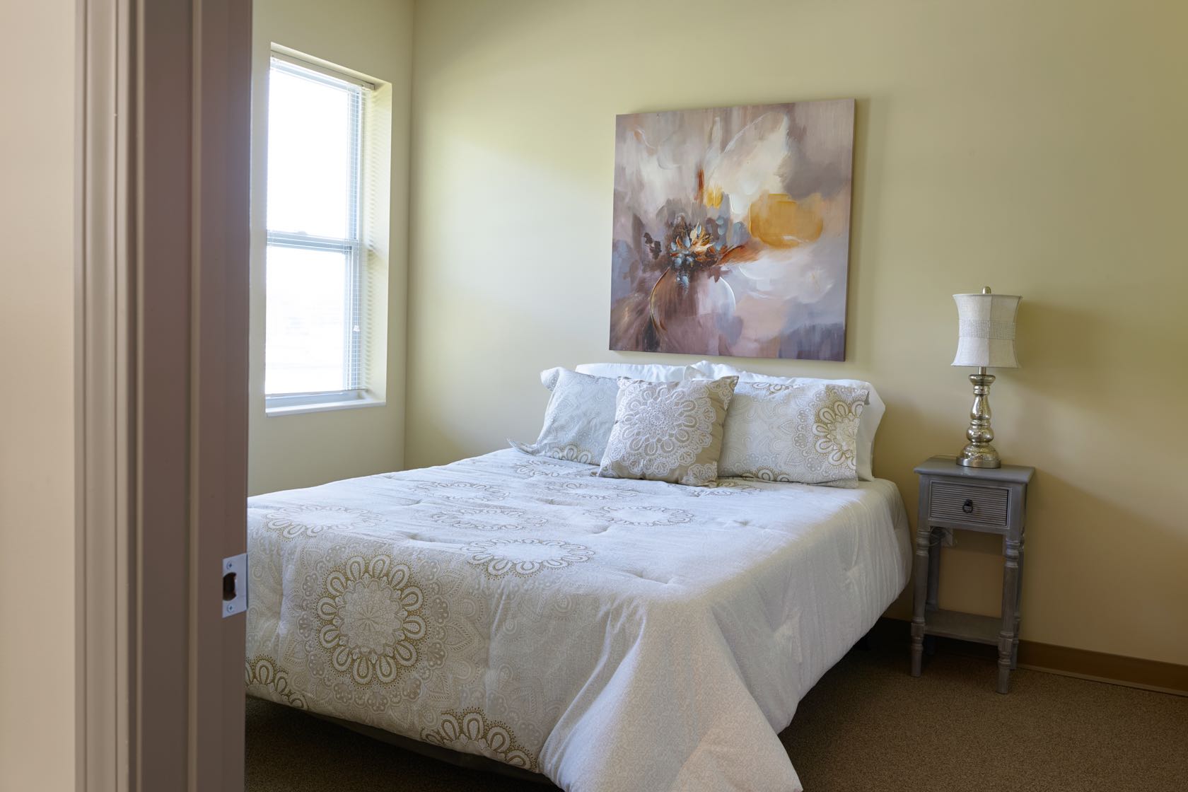 Assisted living apartment bedroom in Hammond