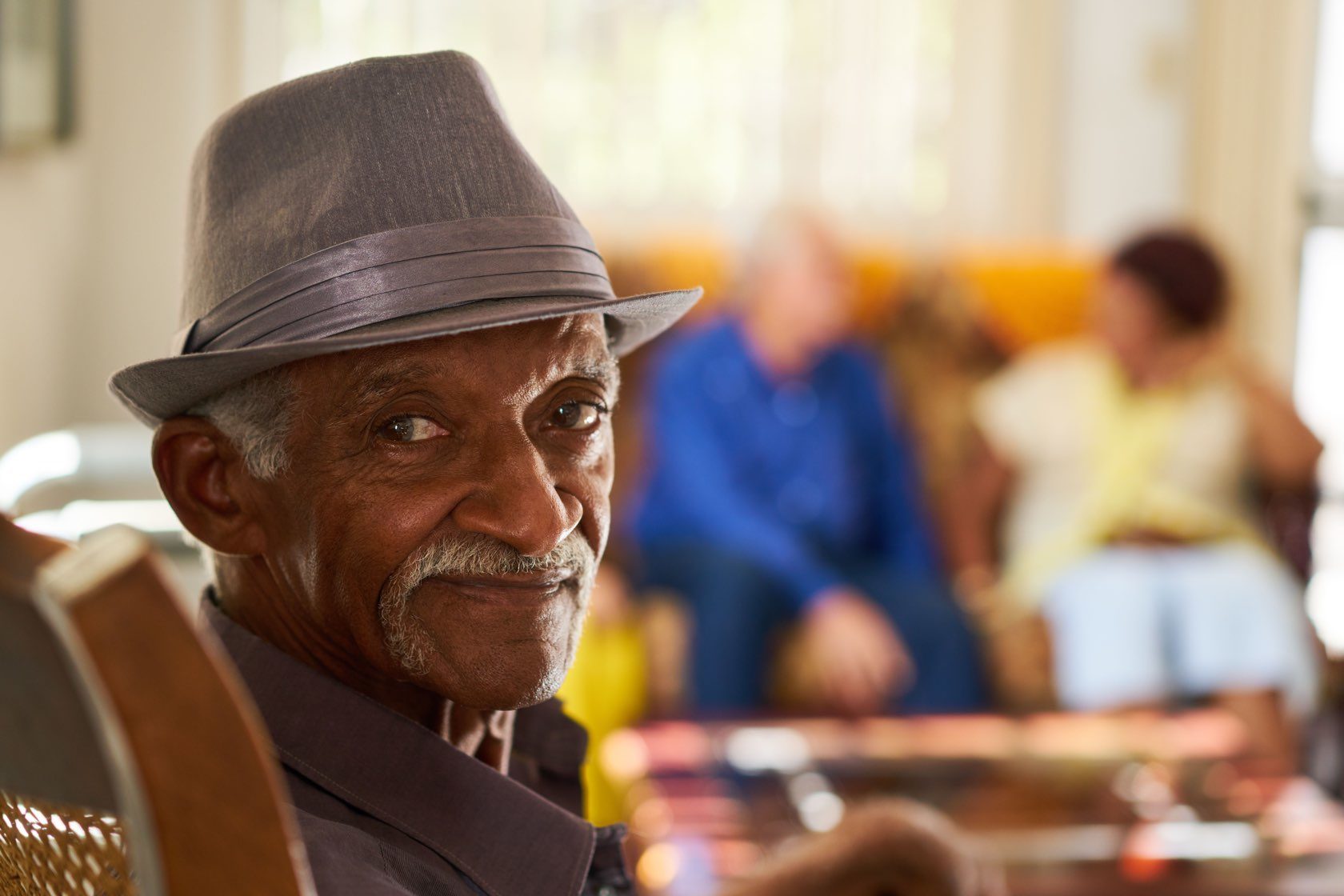 Happy senior relaxing in senior living community at Silver Birch