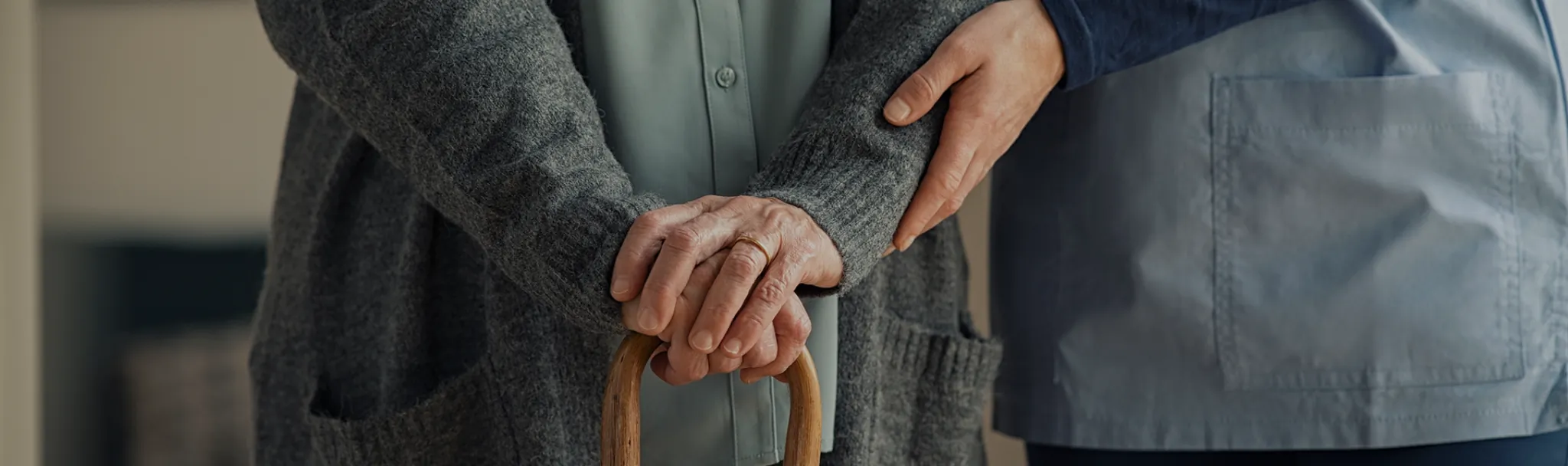 Elderly woman with a cane.
